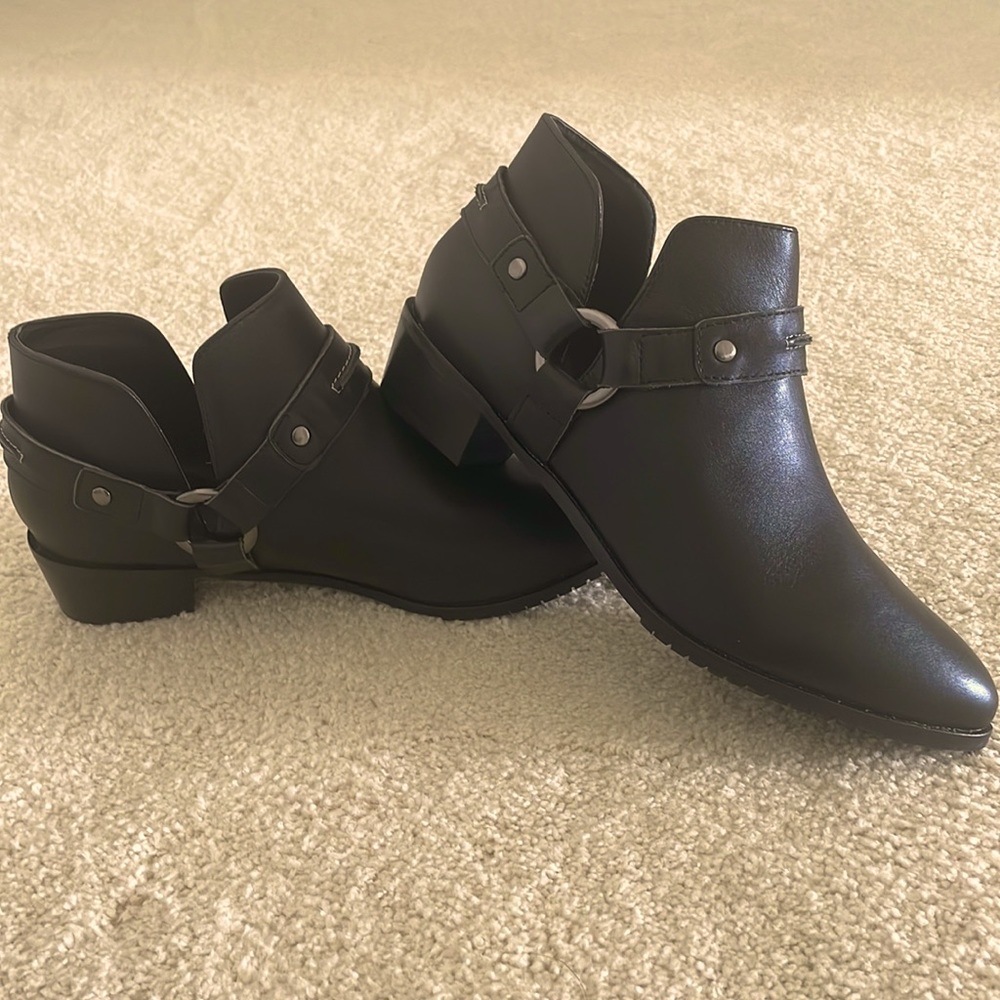 Brand new beautiful ankle boots. Goes with everything from mini to denim!